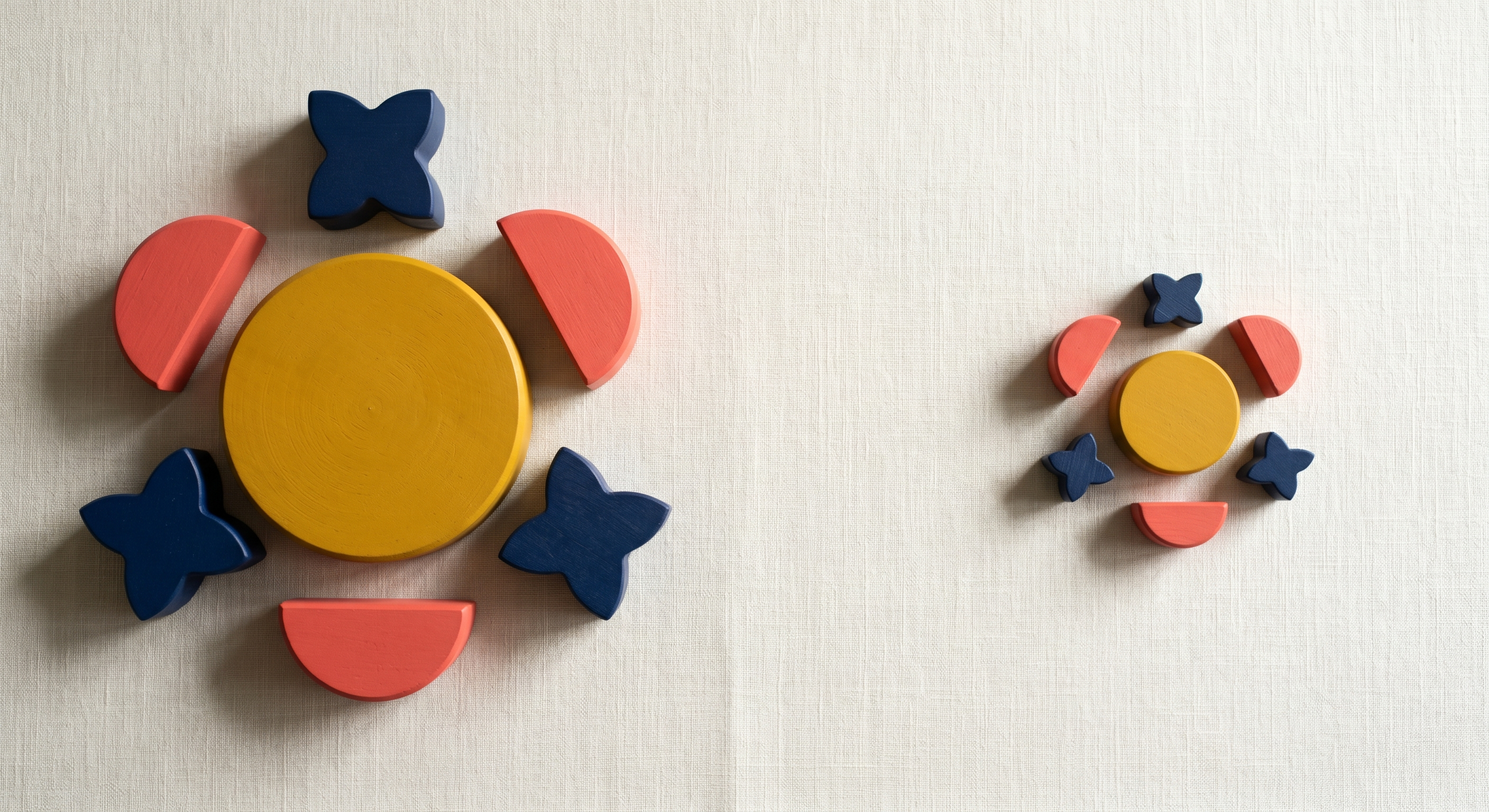 Large Bauhaus block arrangement on the left with a miniaturized version of the same arrangement on the right